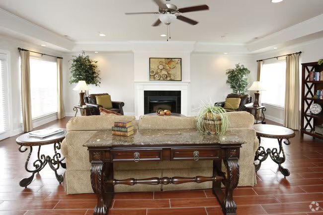 Clubhouse living room with fireplace at Seville Place