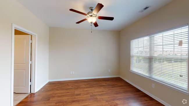 Wide view of an open furnished living space at Seville Place