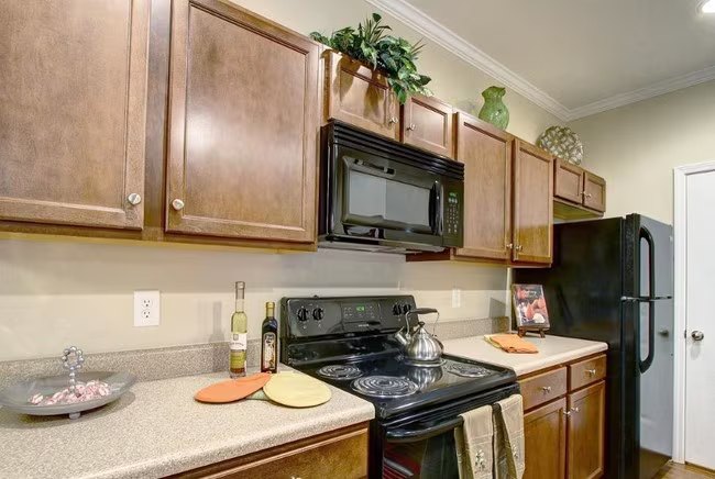 Kitchen with plenty of cabinets and counter space in a Seville Place apartment